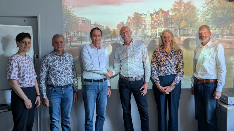 Handen schudden Amsterdam TMC